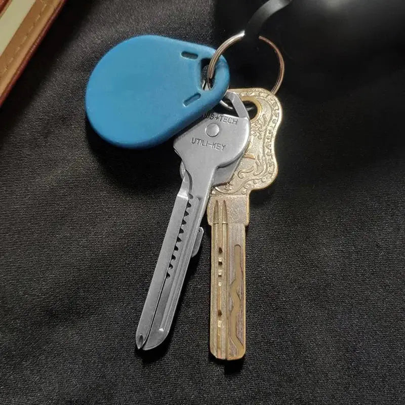 Simples Market 6-in-1 folding multi-tool keychain with blue silicone tag and two keys