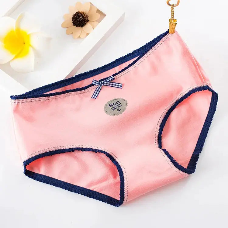 Pink cotton seamless panties for women by Simples Market with navy trim and bow detail