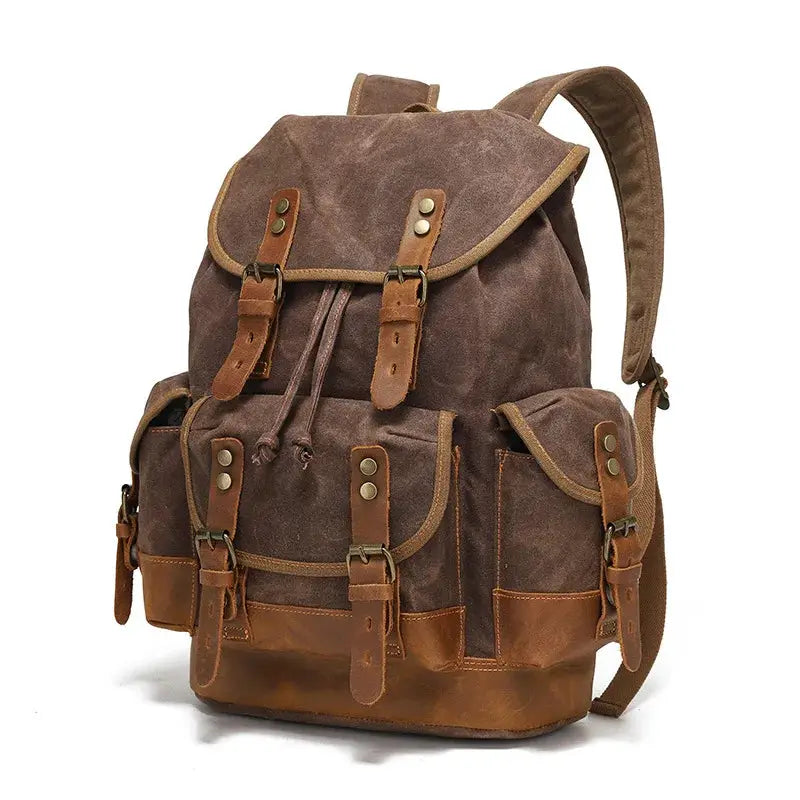 Vintage canvas backpack for men with brown leather straps, front pockets and rugged waxed finish
