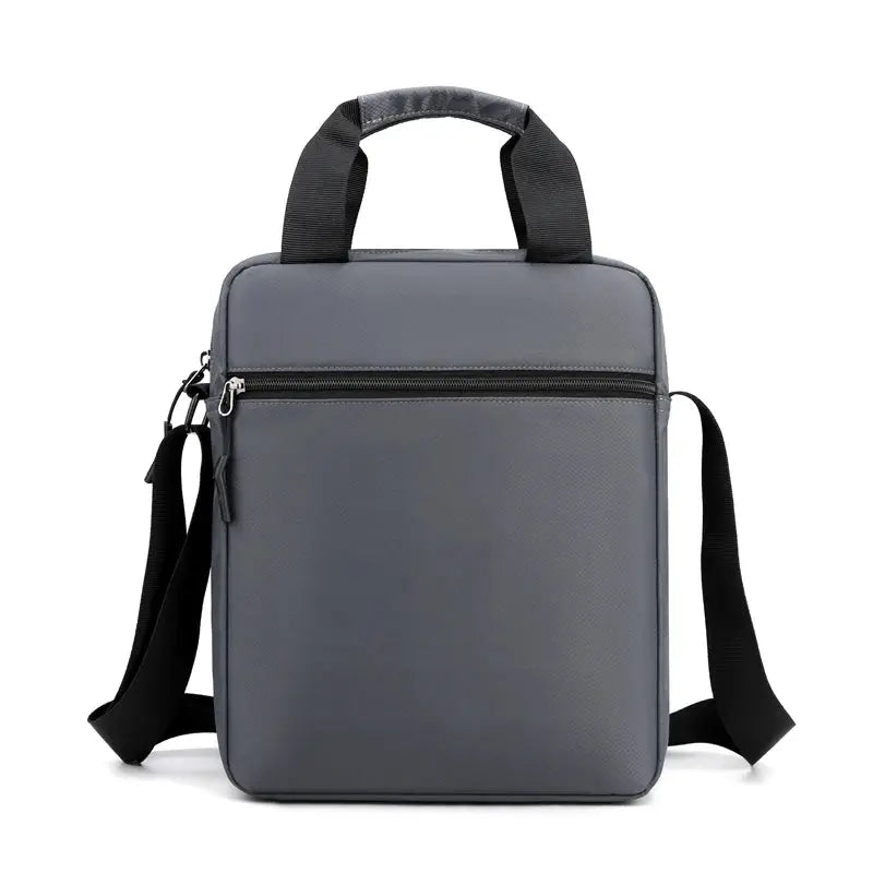 Men's crossbody bag by Simples Market in gray with top carry handles, adjustable shoulder strap and front zipper pocket