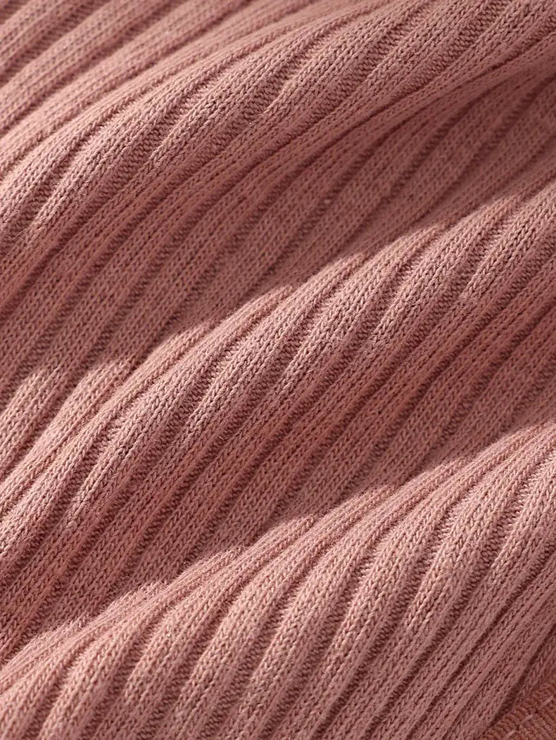 Ribbed pink cotton knit fabric close-up with soft texture for women's lingerie