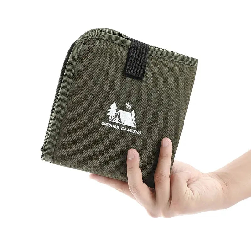 Outdoor Camping Foldable Seat Cushion by Simples Market, olive green moisture-proof mat, held in hand.
