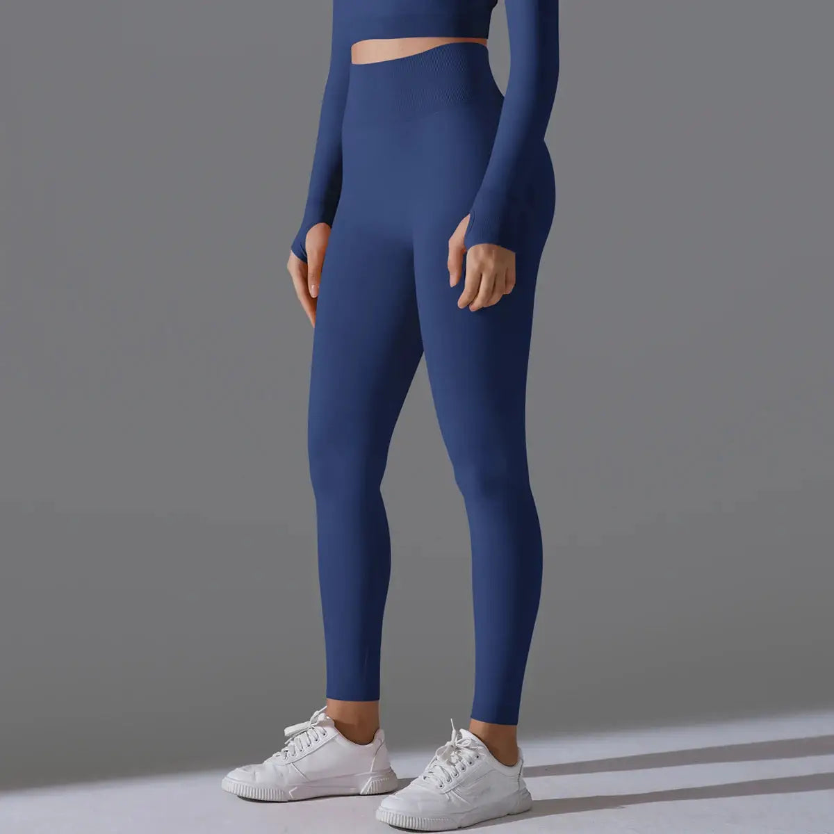 Blue women's seamless yoga leggings with high waist tummy control and scrunch butt lifting for gym and outdoor workouts.