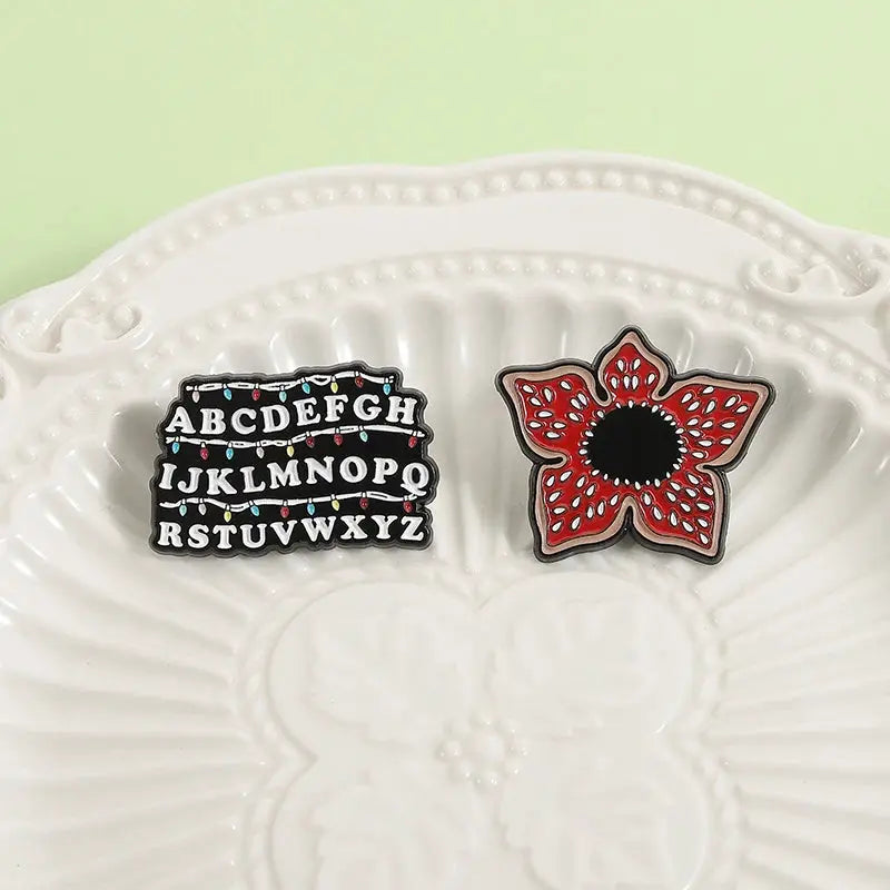 Sci Fi Horror Enamel Pins Cannibal Flowers and 26 English Letter Brooches for Backpacks Lapels and Gifts