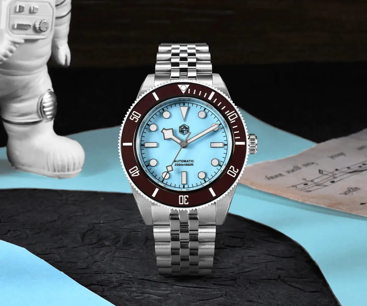San Martin 40mm BB Diver automatic watch with light-blue dial, maroon bezel, stainless steel bracelet.