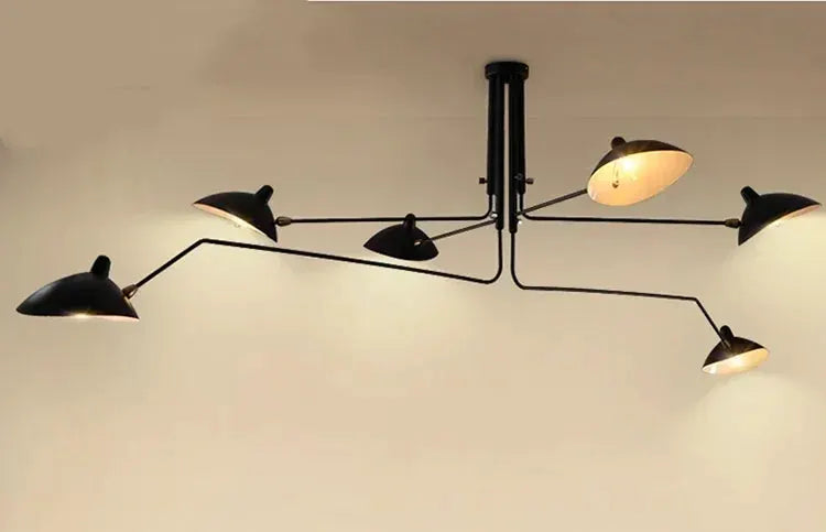 Modern spider-style pendant light in black metal with multiple adjustable arms and LED lamps, for living room or study.