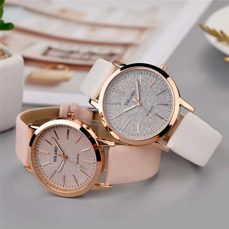 Two Simples Market women's quartz watches with rose-gold cases, glitter dials, and white and pink leather straps