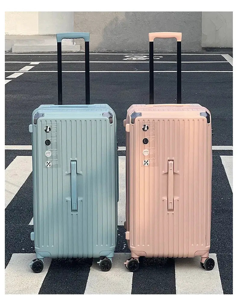 Two-piece hard-shell luggage set in pastel blue and pink with four-wheel spinners.