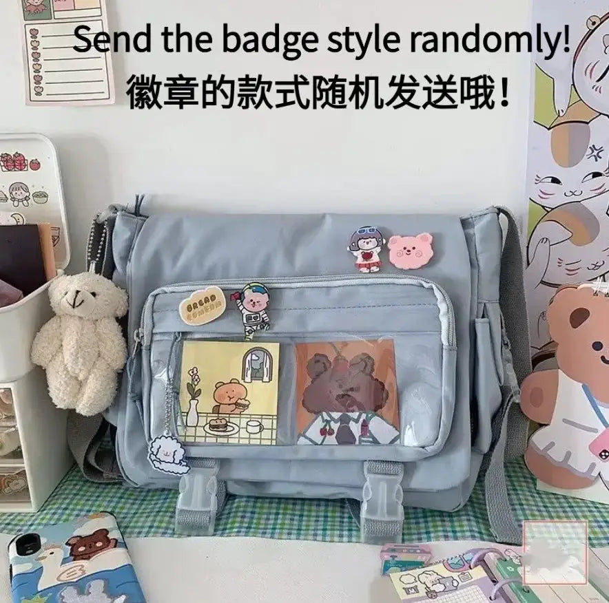 Large-capacity crossbody canvas bag by Simples Market in light blue with front zip pocket and Harajuku-style patches