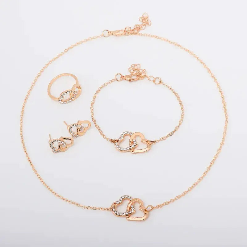 Rose-gold heart jewelry set for women; necklace, bracelet, ring, and two rhinestone earrings