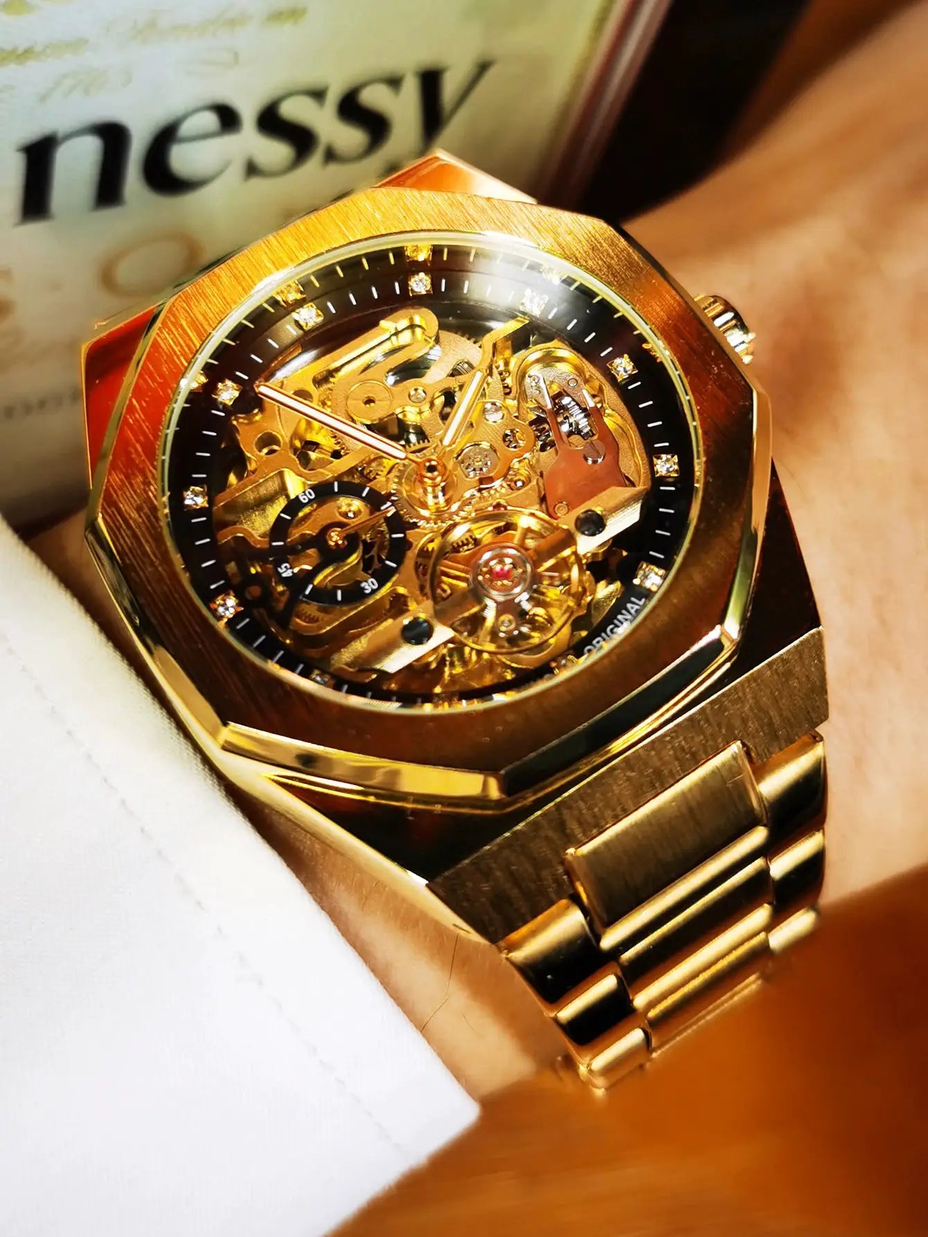 Forsining men's skeleton automatic watch with gold-tone stainless steel strap and luminous hands