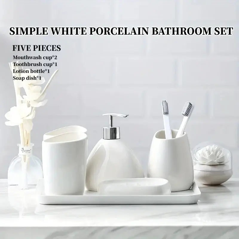 White porcelain bathroom set, five pieces on a tray: two mouthwash cups, toothbrush cup, lotion bottle, soap dish