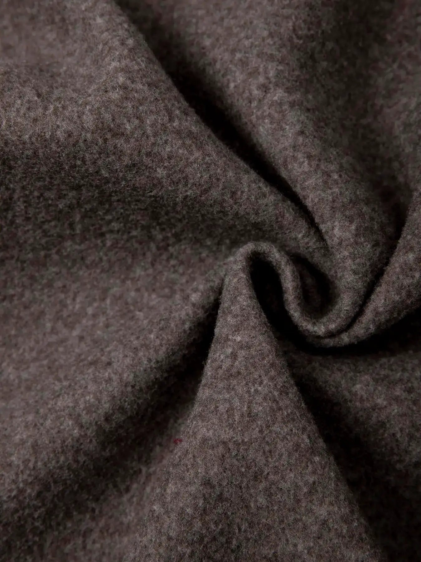 Men's brown knit hooded jacket fabric close-up; heathered texture