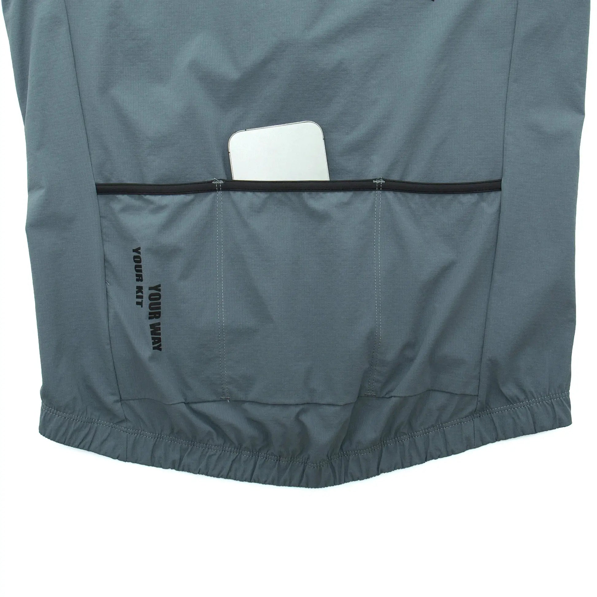 YKYWBIKE men's cycling windbreaker vest in teal thermal fleece with back pocket holding a phone, Simples Market.