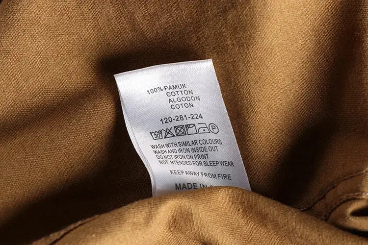 Khaki cotton work shirt by Simples Market, care label visible