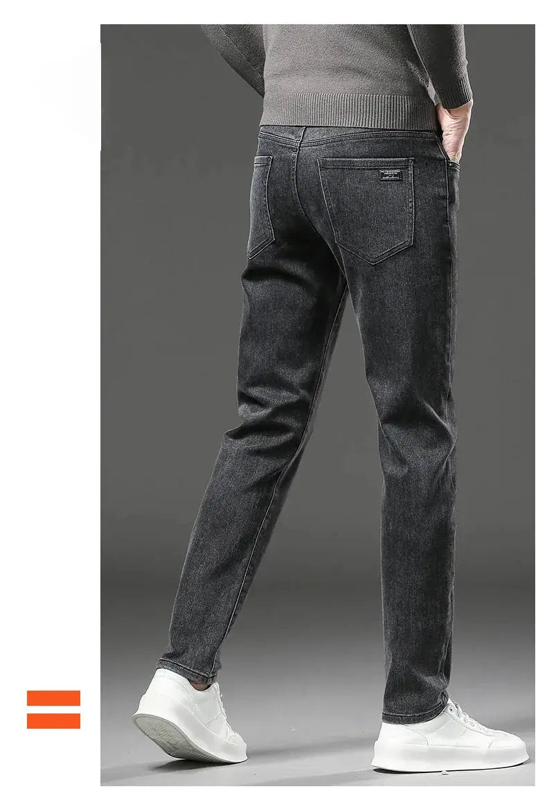 Winter fleece-lined jeans for men, dark wash slim straight with back pockets and small label.