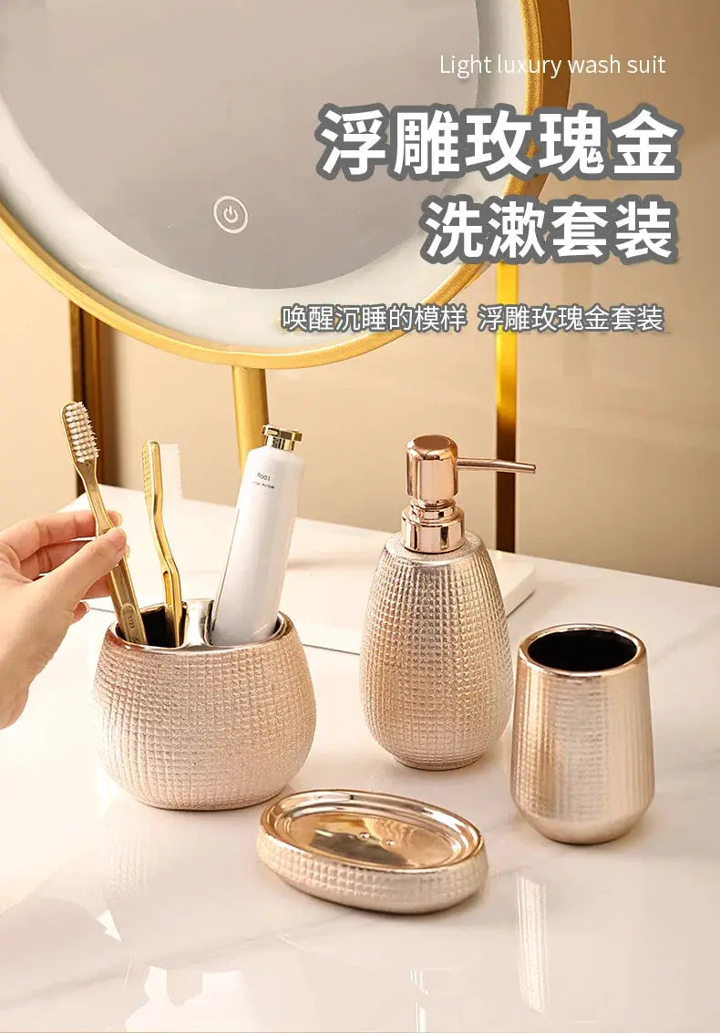 Rose gold ceramic bathroom accessories set with toothbrush holder, lotion bottle, soap dish, and cup