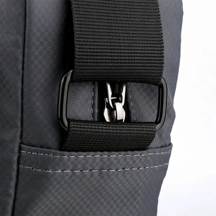 Simples Market men's crossbody bag with adjustable strap in dark gray, closeup on buckle.