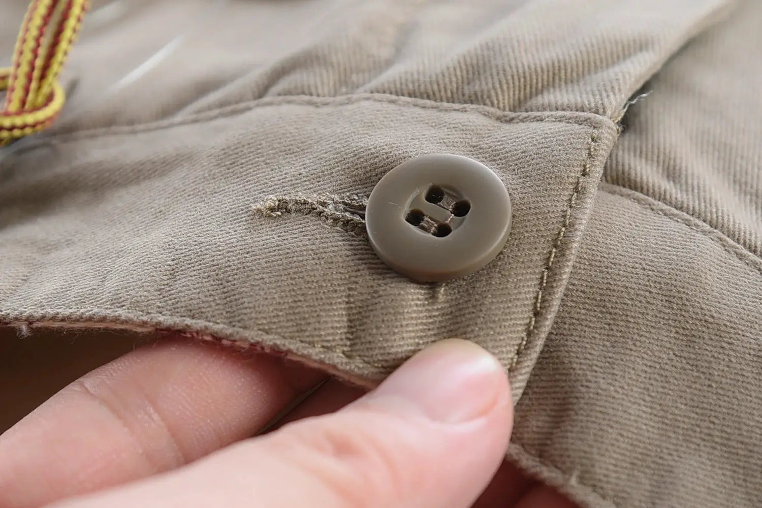 Simples Market driving pants, 100% cotton washed twill, khaki chinos with button detail
