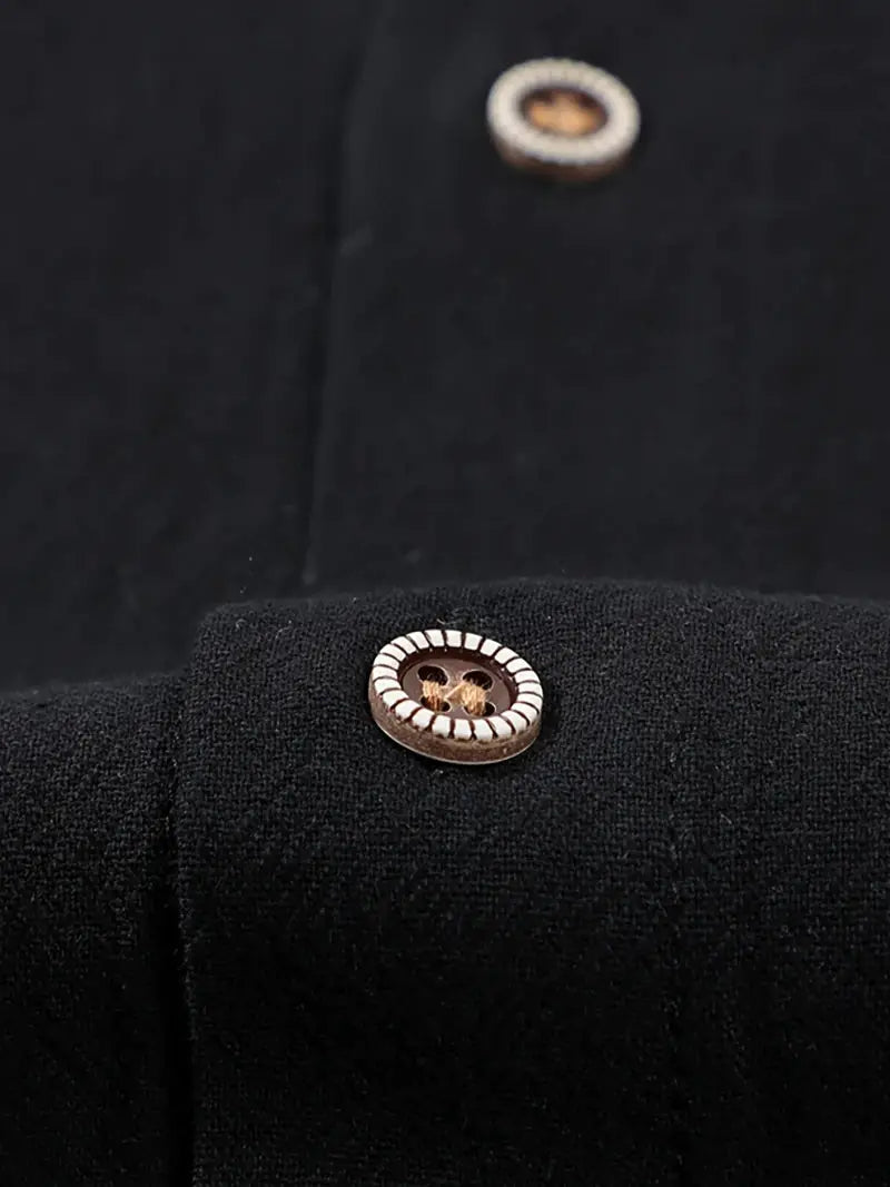 Men's linen button-up short-sleeve shirt in black with metal-rimmed buttons.