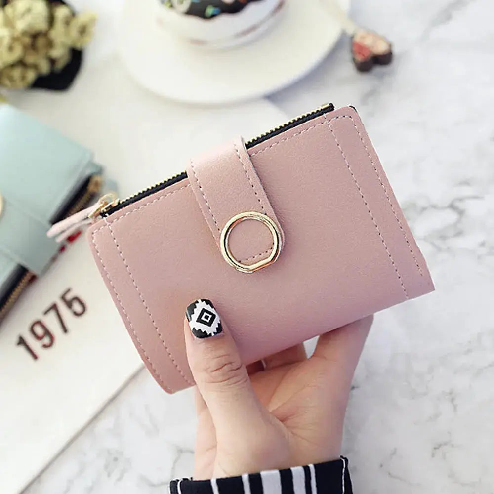 Pink PU leather wallet with zipper closure and gold ring accent by Simples Market