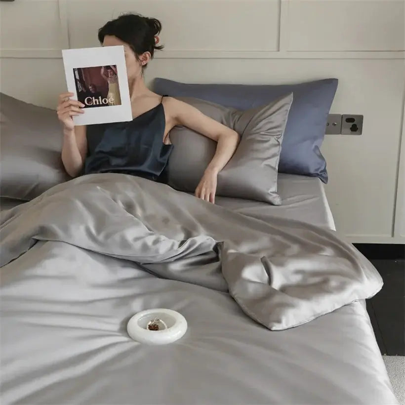 Mulberry silk bedding set by Simples Market in silver-gray; duvet cover, sheet and pillowcases.