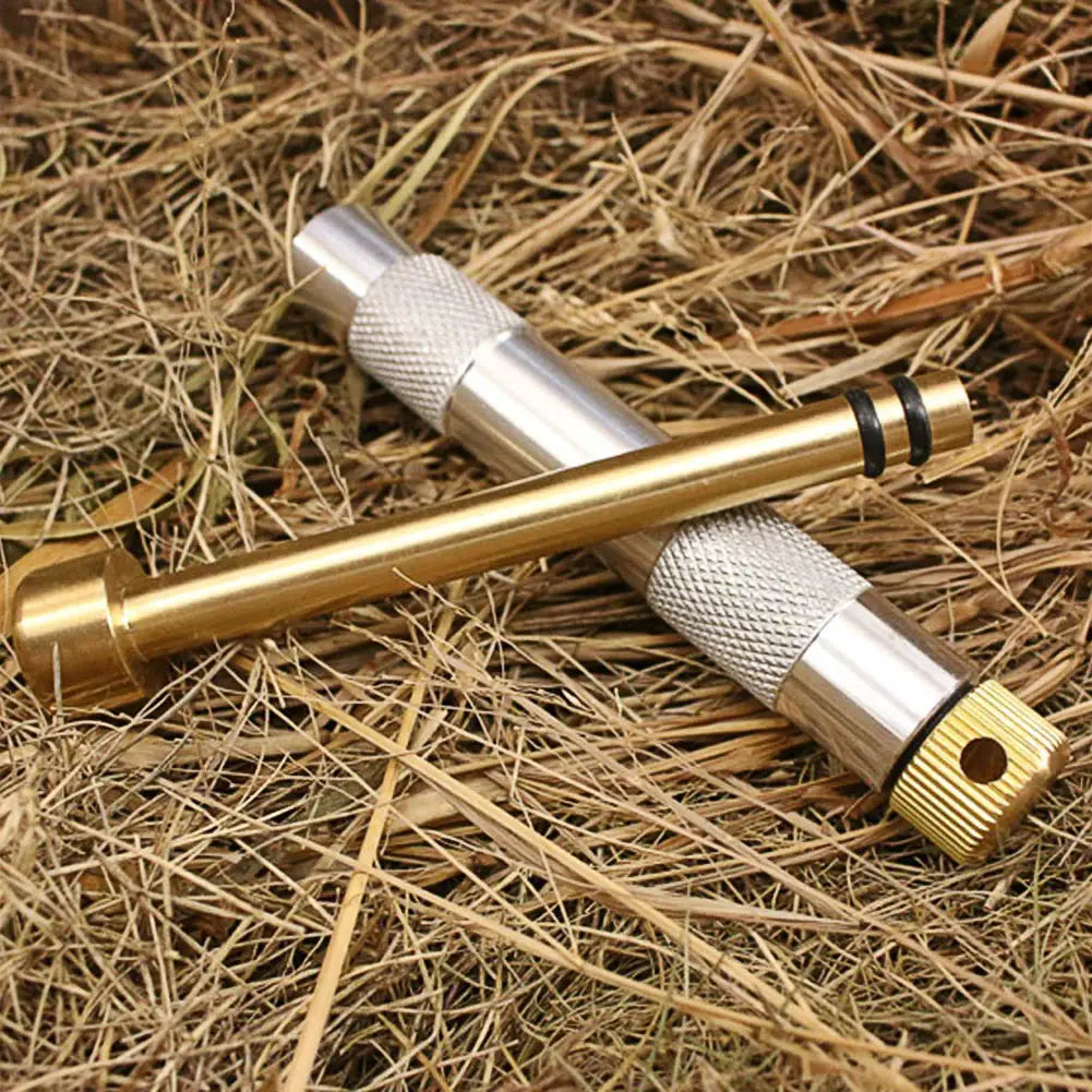 Brass emergency fire-start piston tool with knurled grip and threaded end; two ignition tubes for camping survival