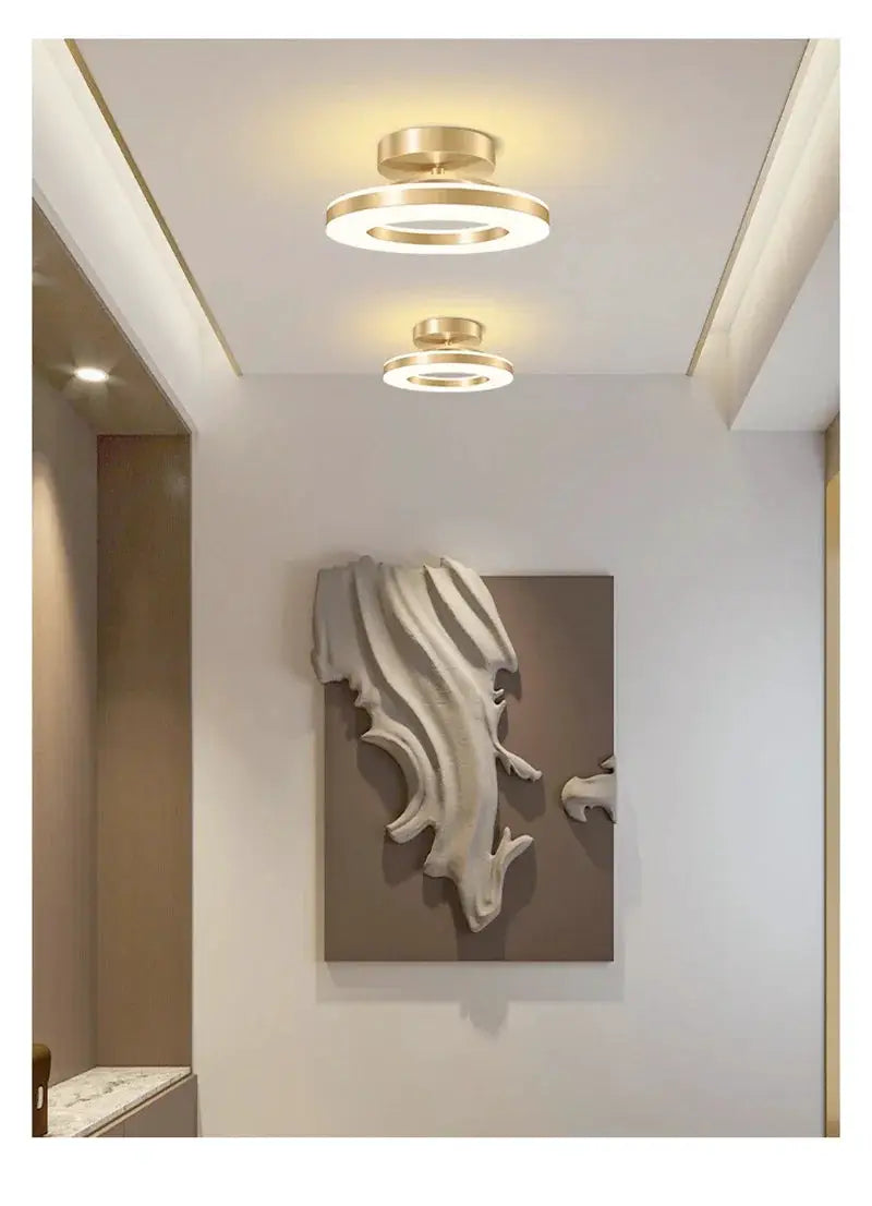 Modern LED ceiling lamp by Simples Market; gold circular ring design, dual-ring fixtures