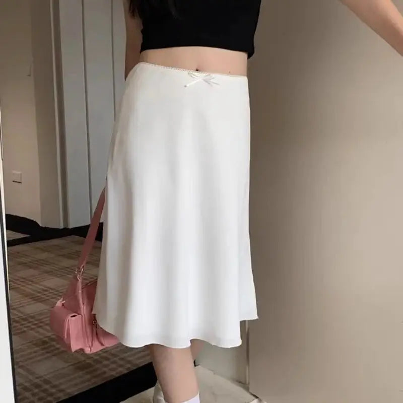 White satin A-line midi skirt for women with a small waist bow detail