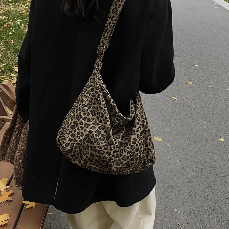 Leopard print shoulder bag by Simples Market; soft textile, large-capacity crossbody for commute
