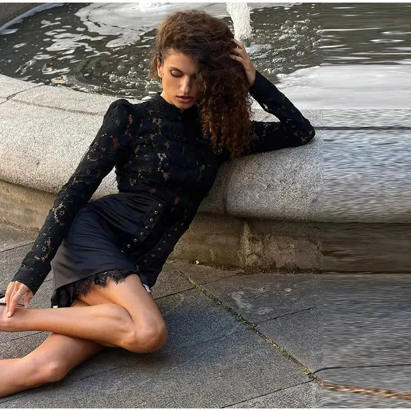 Urban lace patchwork women's skirt in black with belted waistband and eyelet accents.