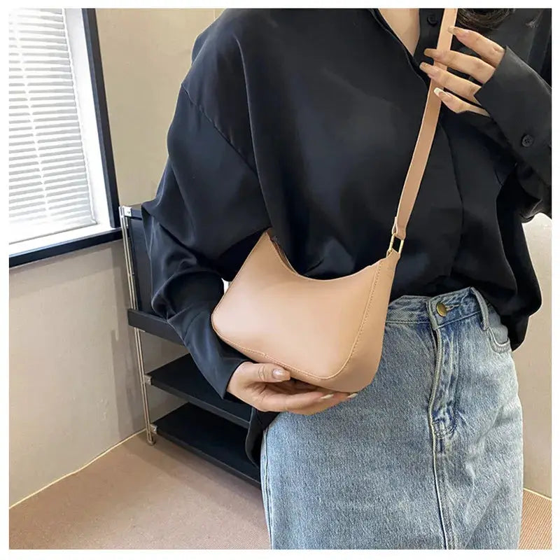 Tan square handbag with a beige single-shoulder strap; compact solid-color crossbody bag