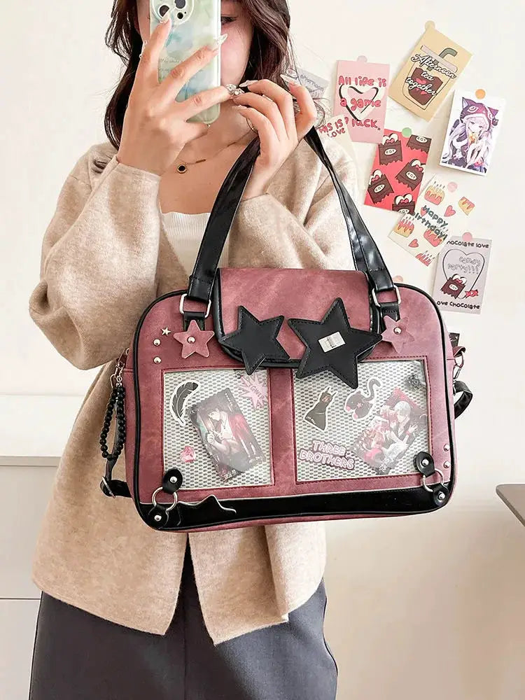 Y2K star ita bag in pink with transparent front pockets, black star patches and crossbody strap