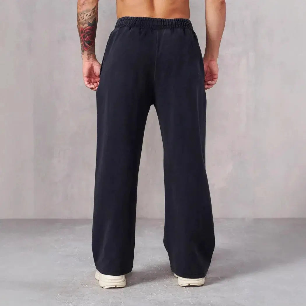 Men's navy straight-leg sweatpants, loose-fit joggers with large pockets.
