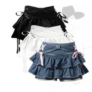 Bow-accented mini skirts in black, white, and blue denim with tiered ruffles (3-pack)