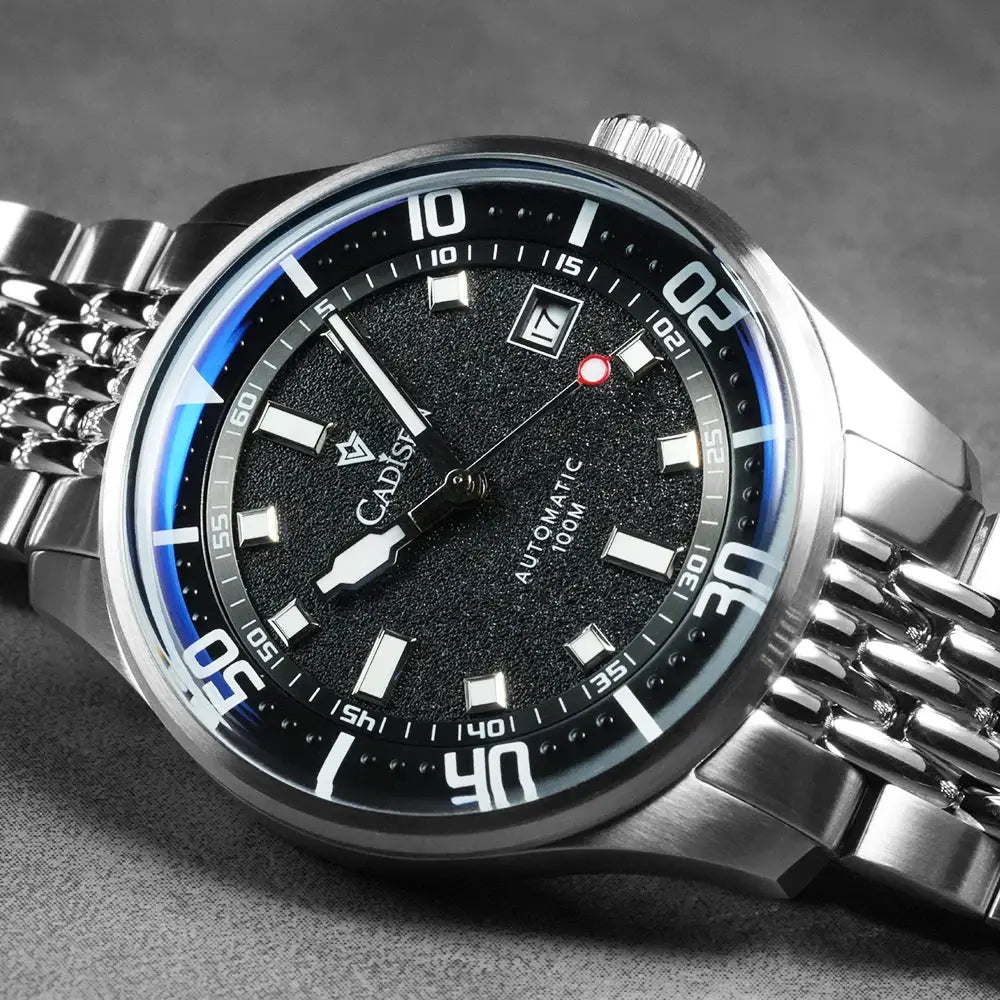 CADISEN men's stainless steel automatic watch with textured black dial, date window, blue bezel, 100m water resistant