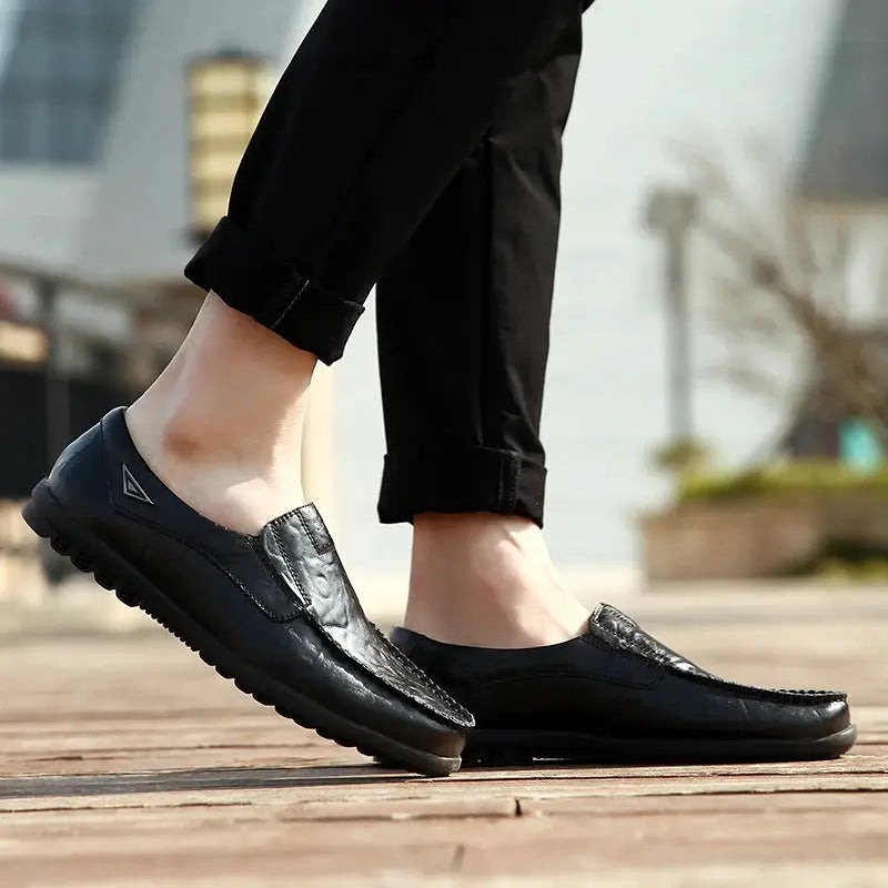 Men's genuine leather black slip-on loafers; breathable moccasin-style driving shoes.