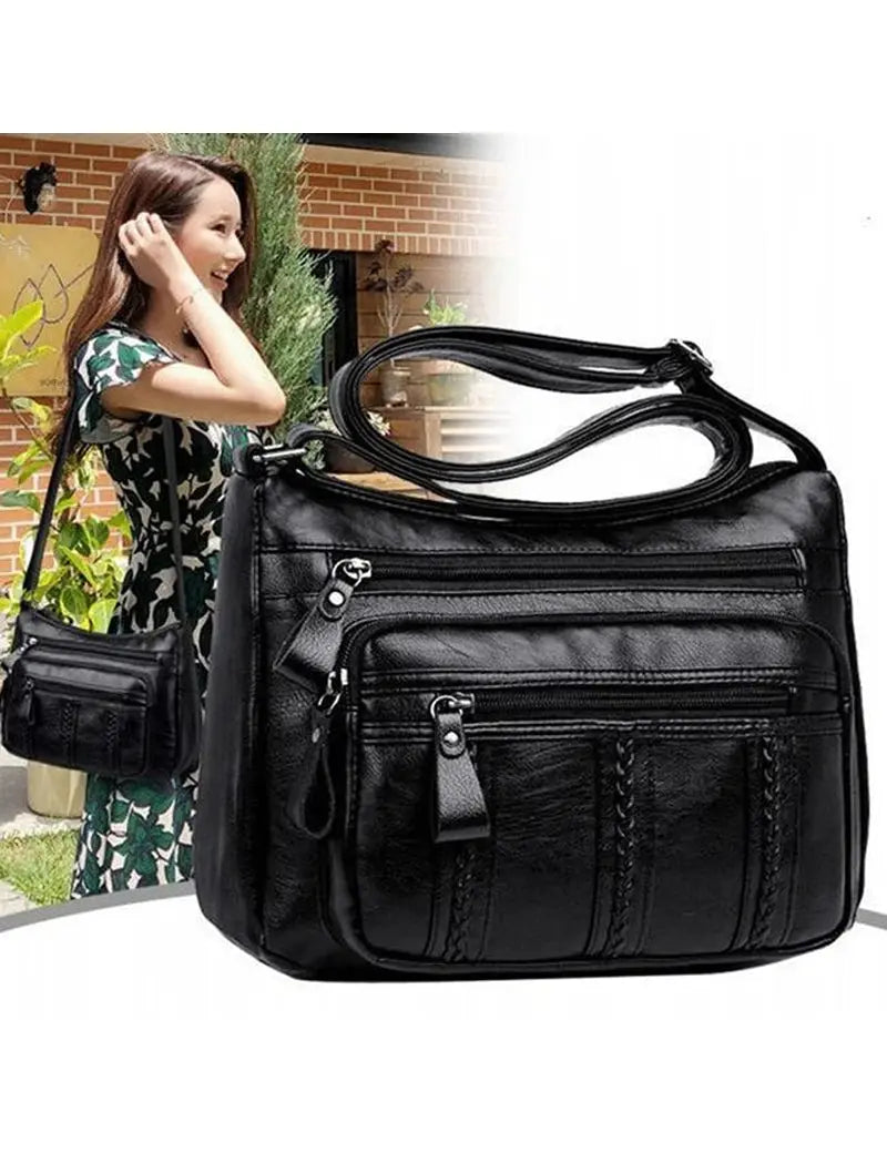 Simples Market women's black PU leather multi-pocket shoulder bag with crossbody strap and zip pockets.