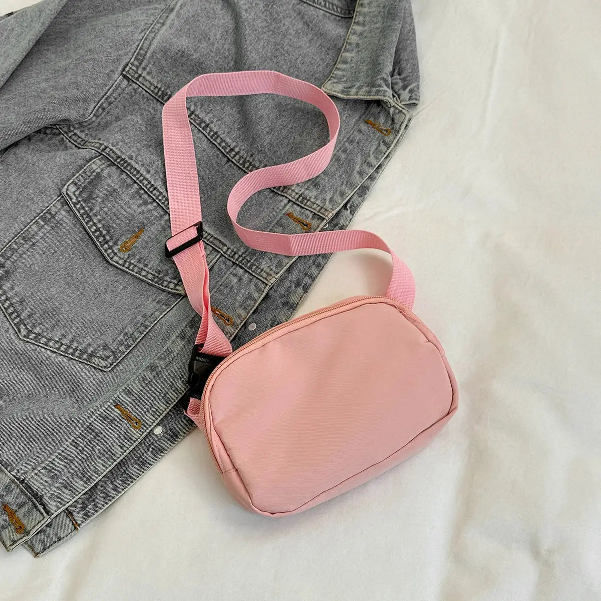 Pink sport waist bag by Simples Market; compact crossbody fanny pack with adjustable strap