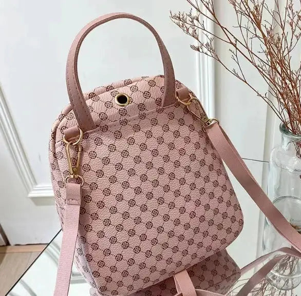 Classic Women Backpack by Simples Market in pink dotted pattern with top handles and adjustable shoulder strap