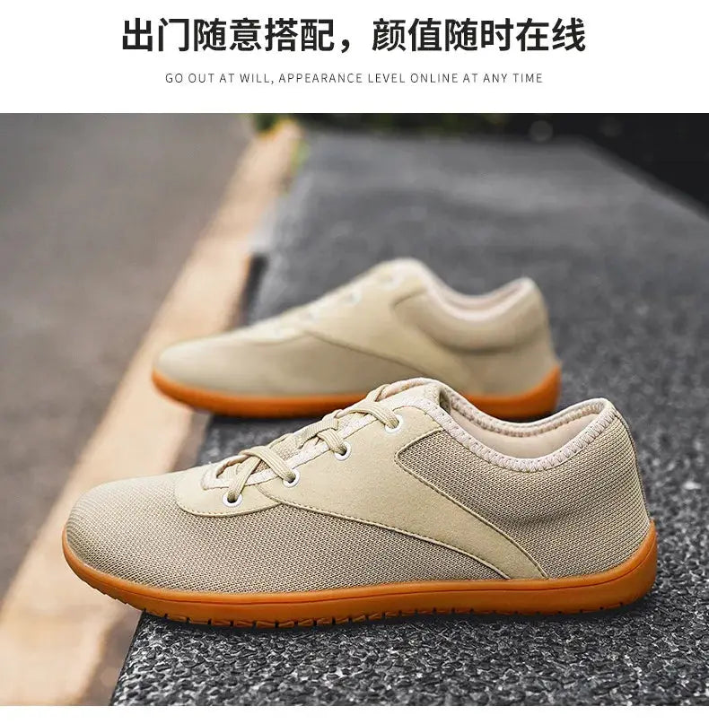 Simples Market pair of men's minimalist trail running shoes, beige mesh upper with orange sole.