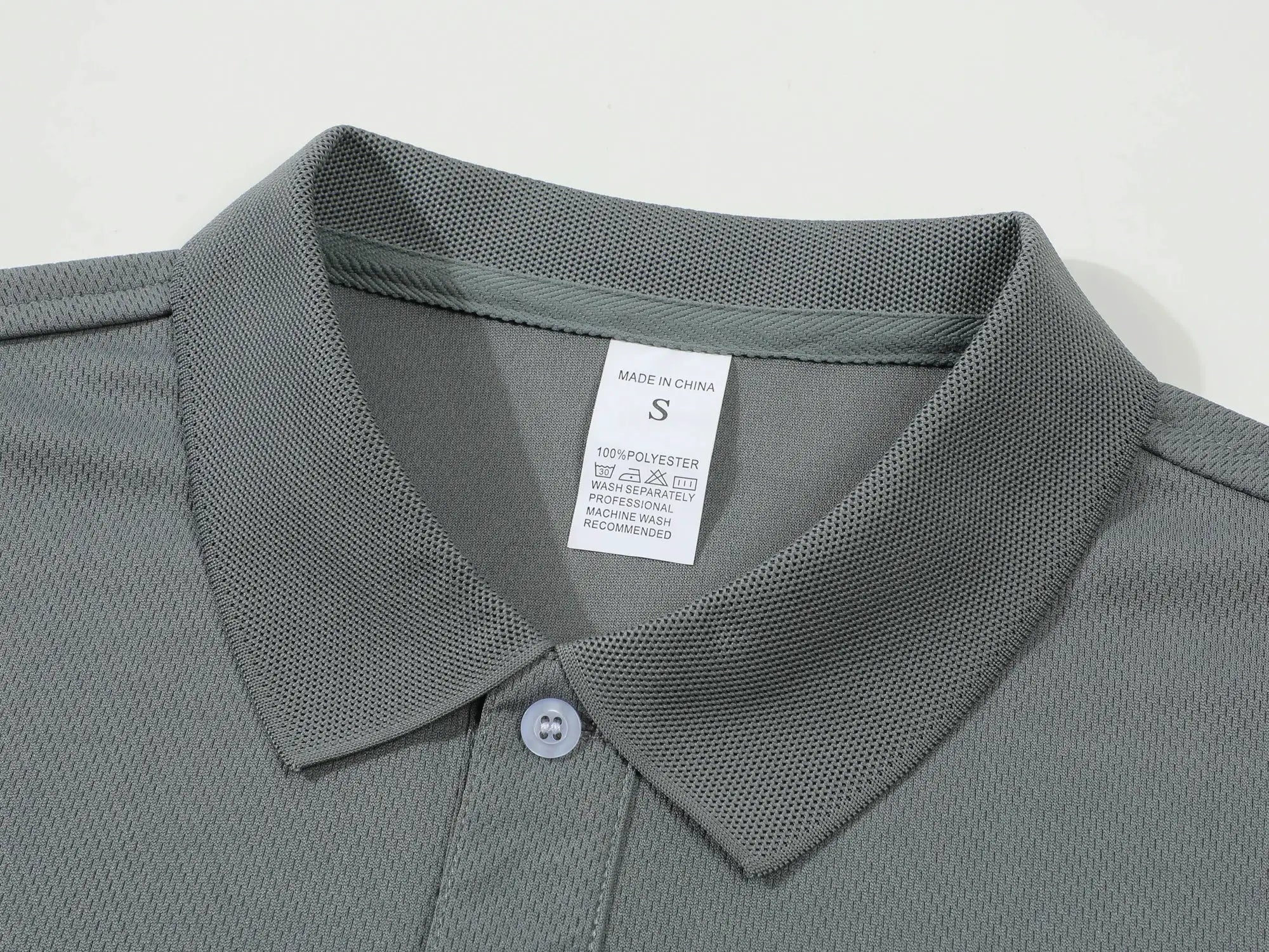 Men's gray polo shirt with textured breathable knit fabric and collar detail
