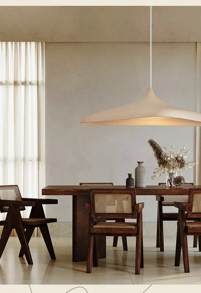 Japanese Wabi Sabi style LED pendant light with cream shade hanging above a wooden dining table