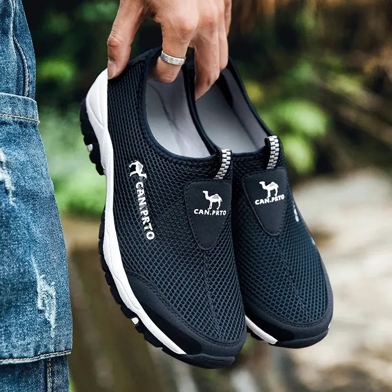 Men's navy mesh slip-on sneakers with breathable upper and white sole
