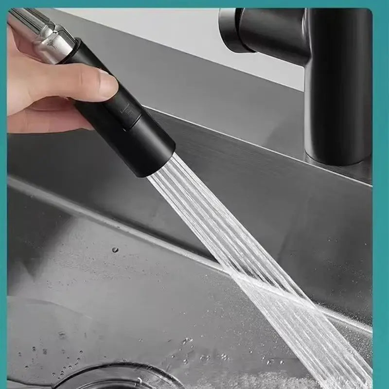 Simples Market kitchen pull-out spray head in black with metal spray nozzle attached to a modern faucet