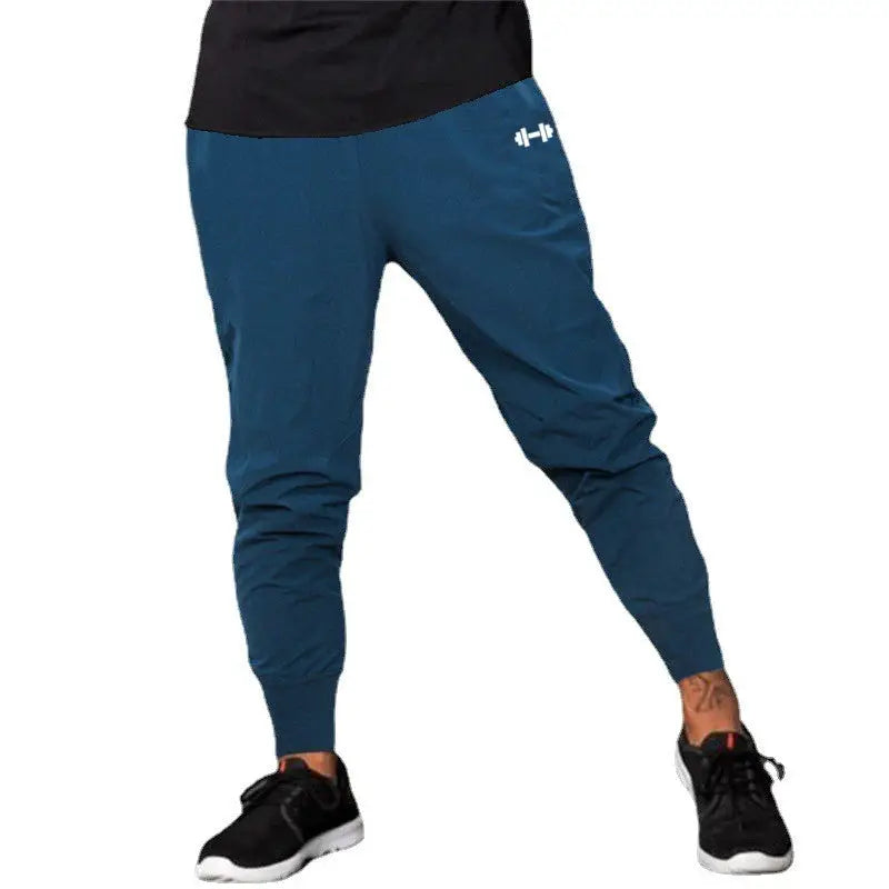 Men's gym pants by Simples Market in blue, ultra-thin quick-dry, high-waist elastic long joggers.