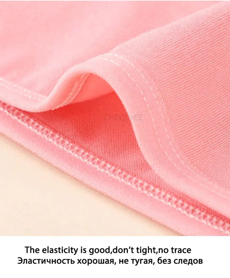 Pink cotton women's panties fabric close-up, breathable soft material and elastic waistband.