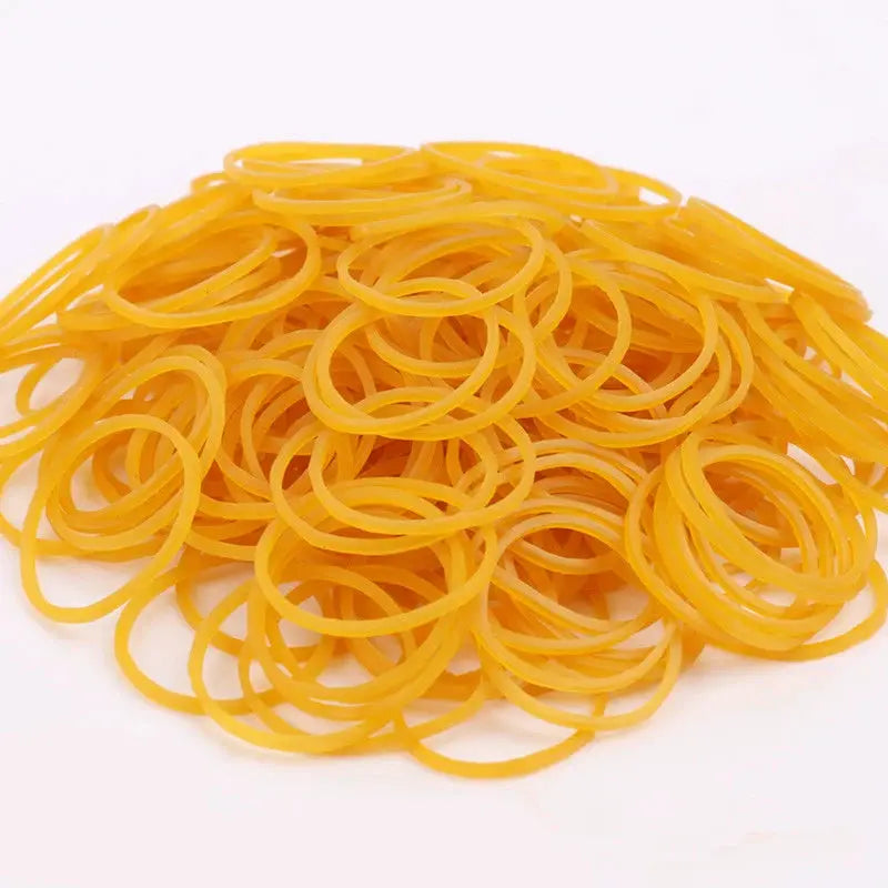 Yellow rubber bands bulk pile; high elasticity and high-temperature resistance.