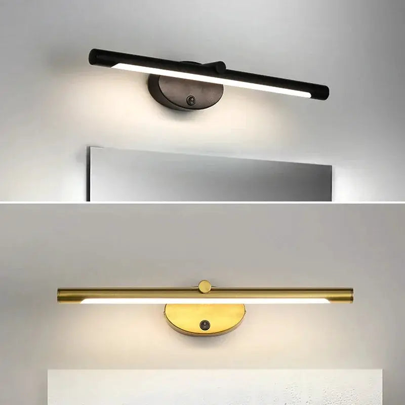 Two modern LED wall lamps in black and brass finishes with touch switches above a bathroom mirror