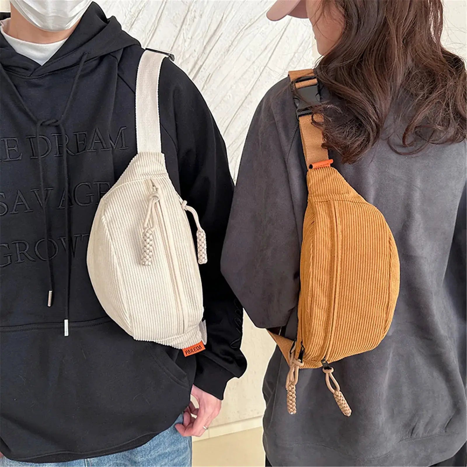 Two corduroy belt bags for women; beige bag with white strap on left and orange bag on right.